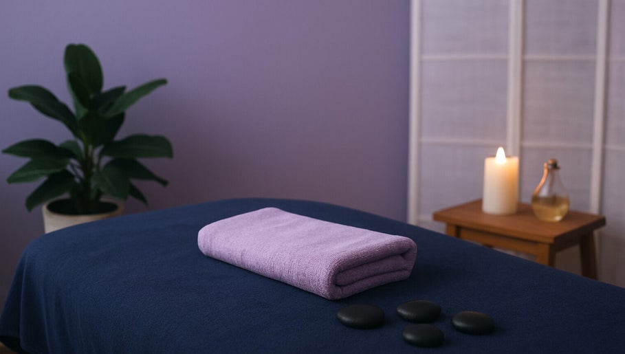 Relaxing massage setup at 416 Skin Aesthetics & Academy in Toronto, Ontario, CA with candles and stone therapy.