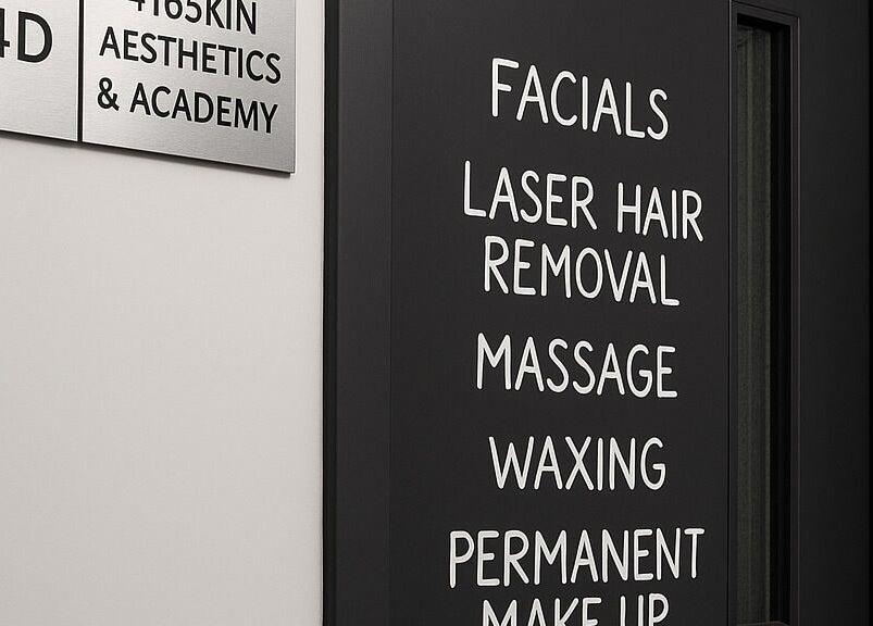 Door signage of 416 Skin Aesthetics & Academy, Toronto, Ontario, CA, detailing services like facials and massages.