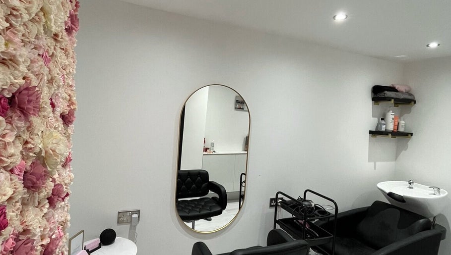 Elegant salon interior with floral wall at Hair by Grace Loveday, London, England, GB.