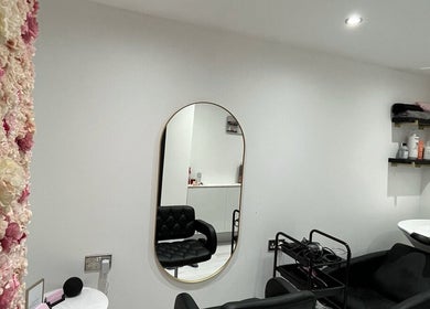 Elegant salon interior with floral wall at Hair by Grace Loveday, London, England, GB.
