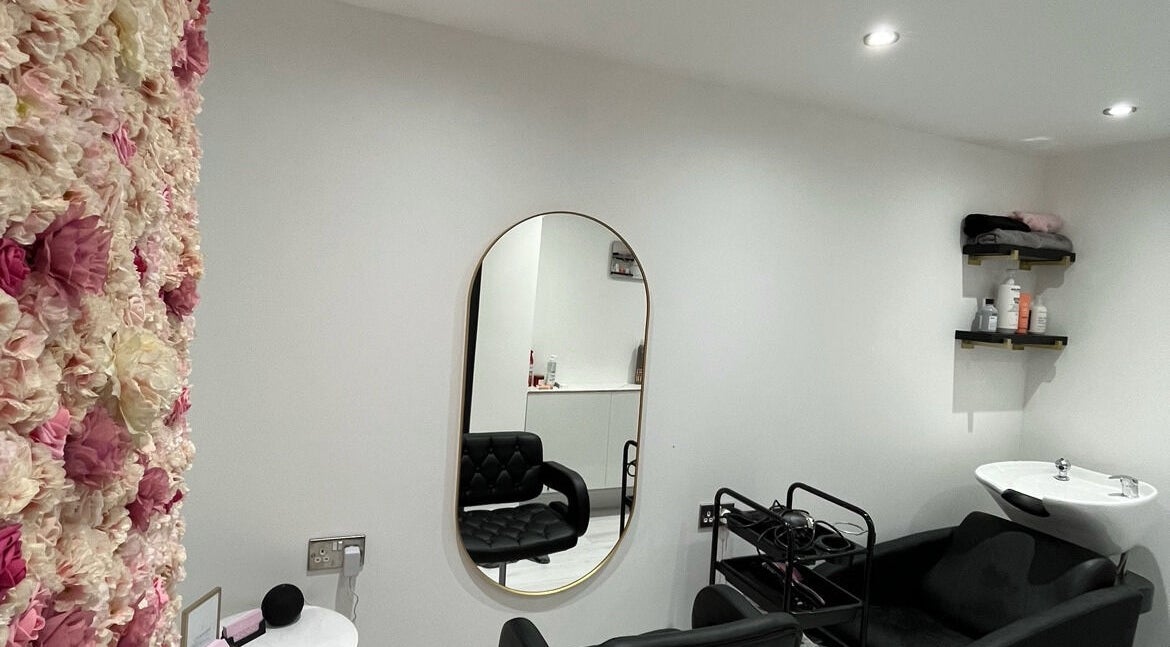 Elegant salon interior with floral wall at Hair by Grace Loveday, London, England, GB.