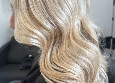 Blonde wavy hairstyle at Hair by Grace Loveday, London, England, GB.