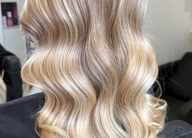 Blonde wavy hairstyle at Hair by Grace Loveday, London, England, GB.