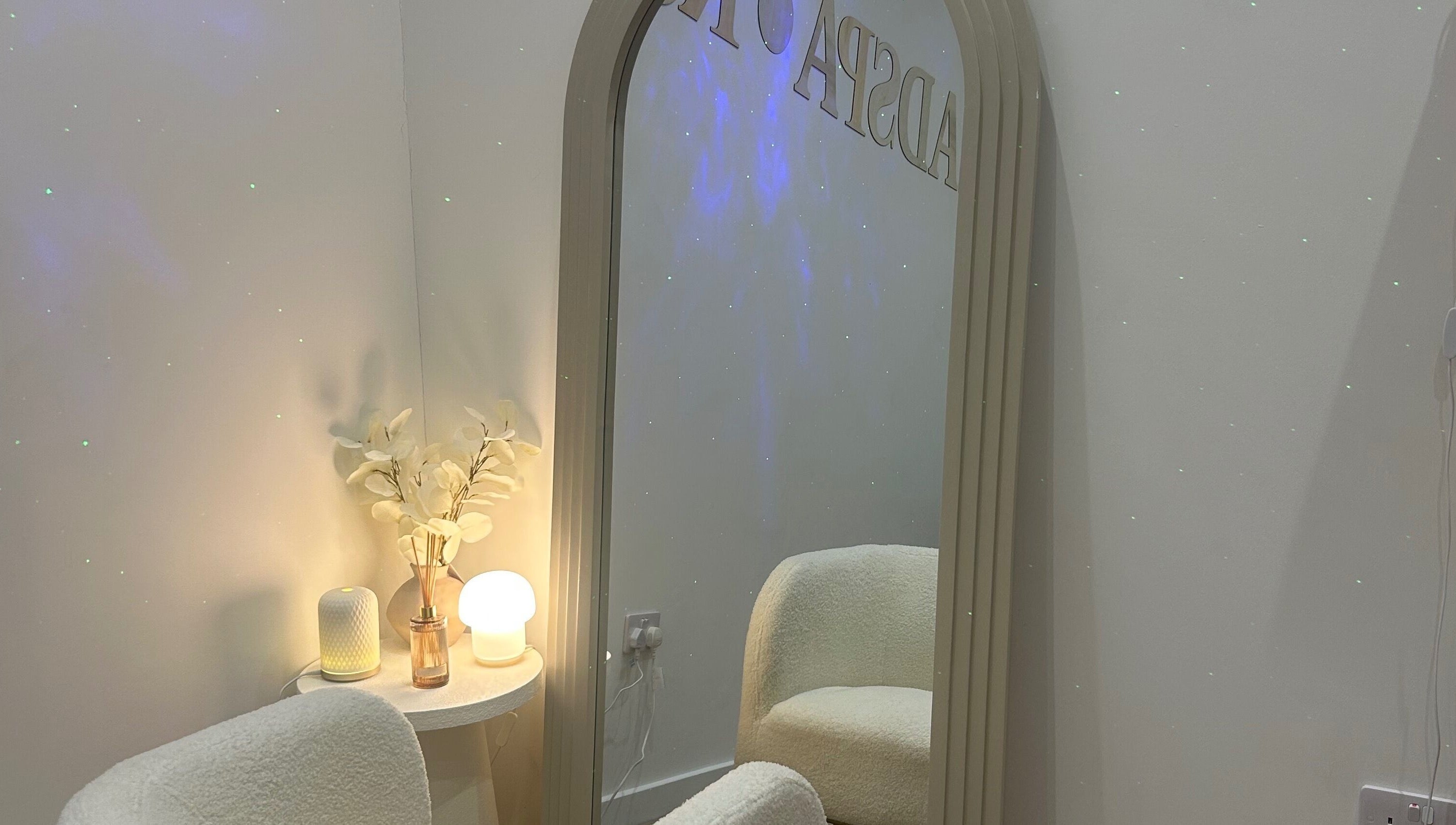 Inviting space in The HeadSpa Room, Glasgow, Scotland, GB with a plush chair and ambient lighting.