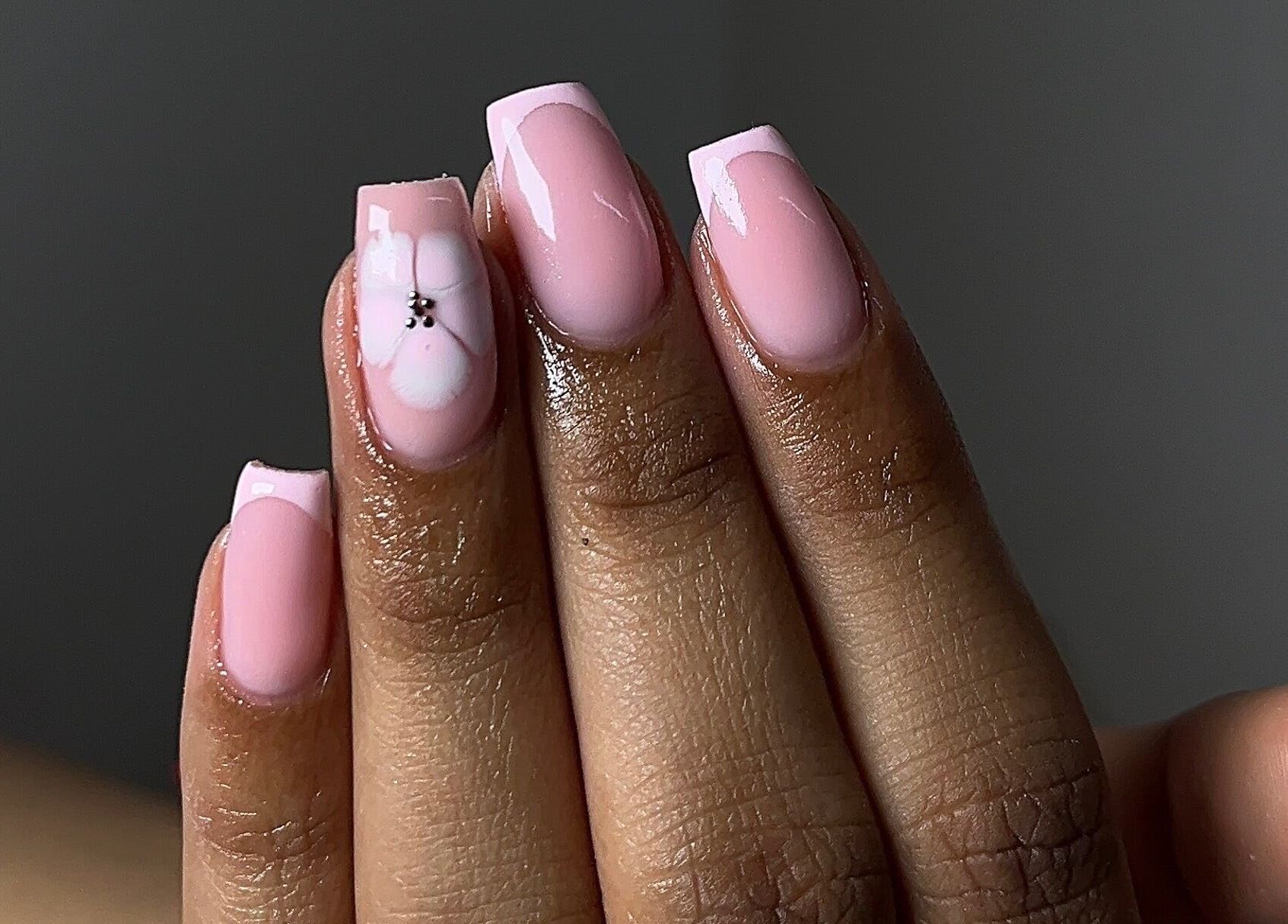 Elegant pink nails with flower design by Saintysclaws in Randburg, Gauteng, ZA.
