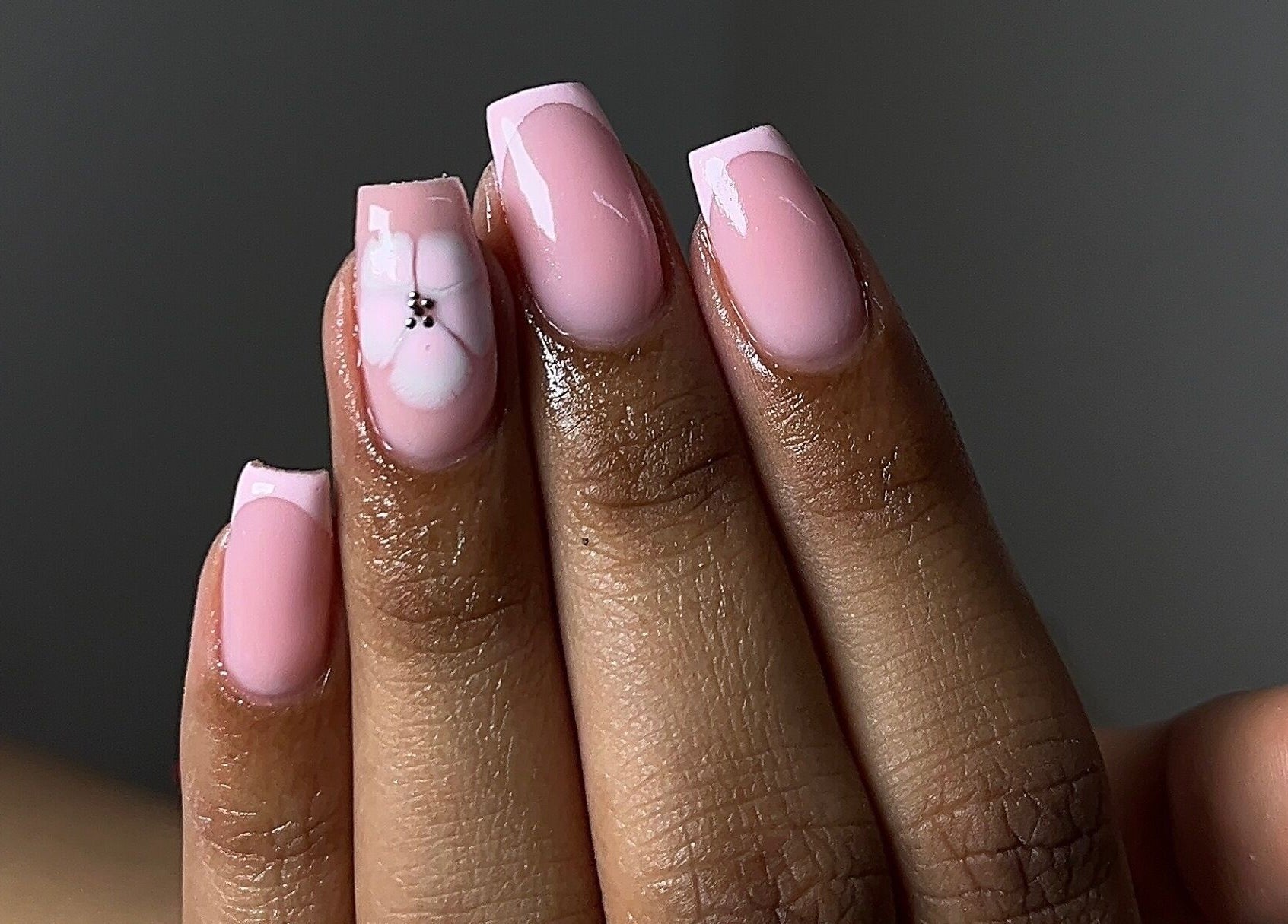 Elegant pink nails with flower design by Saintysclaws in Randburg, Gauteng, ZA.