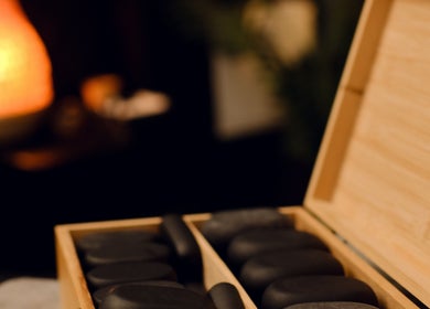Hot stone set at Feel Good Massage Studio, Warszawa, Województwo Mazowieckie, PL, creating a calming ambiance.