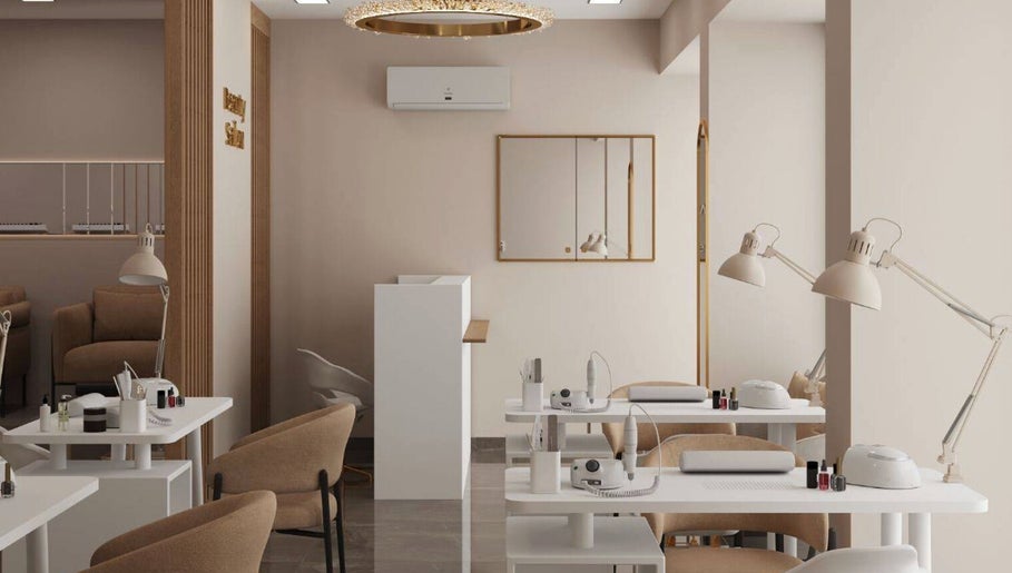Chic modern interior of Double Space, Lisboa, Lisboa, PT with beige chairs and white tables.