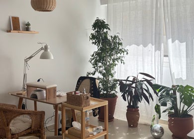 Bright nail station at Ordo Beauty Salon, Rabat, Rabat-salé-kénitra, MA with wicker chair and green plants.