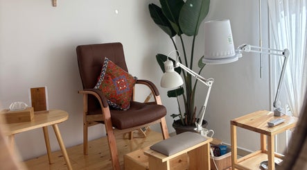 Comfortable seating with a vibrant pillow at Ordo Beauty Salon, Rabat, Rabat-salé-kénitra, MA.