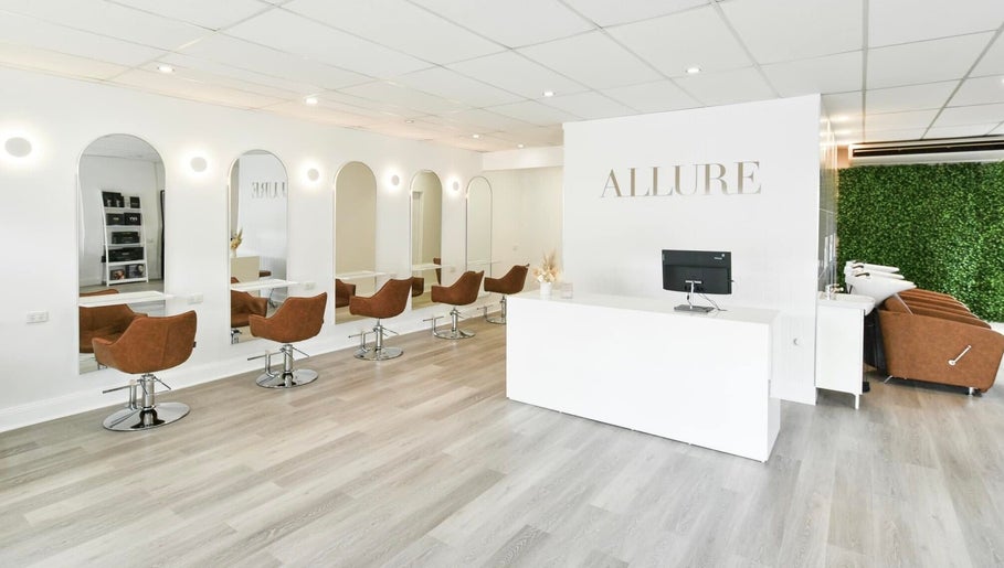 Stylish interior of Allure Hair and Beauty Co in Mitchelton, Queensland, AU, showcasing modern seating and decor.