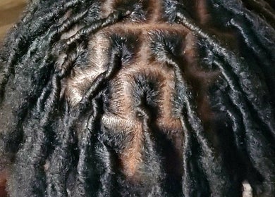 Detailed view of beautifully styled locs at 🩷LocsOfLove🖤 salon in Redhill, England, GB.