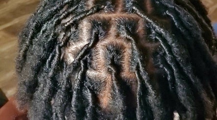 Detailed view of beautifully styled locs at 🩷LocsOfLove🖤 salon in Redhill, England, GB.