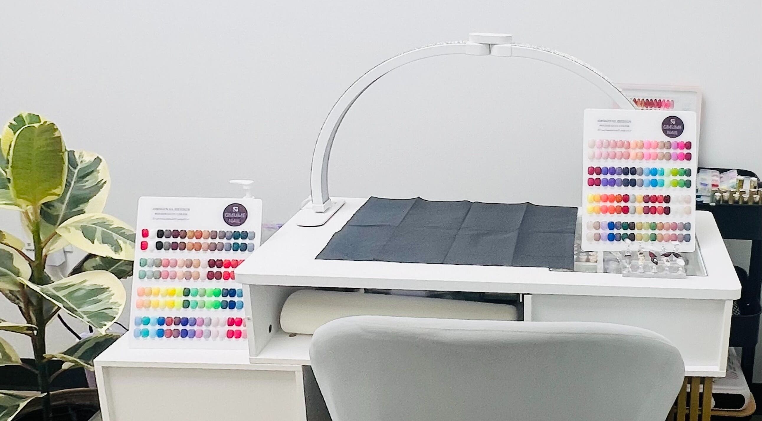 Phanlashtic & Nails Studio nail color palette on a manicure table in Richmond, Texas, US.