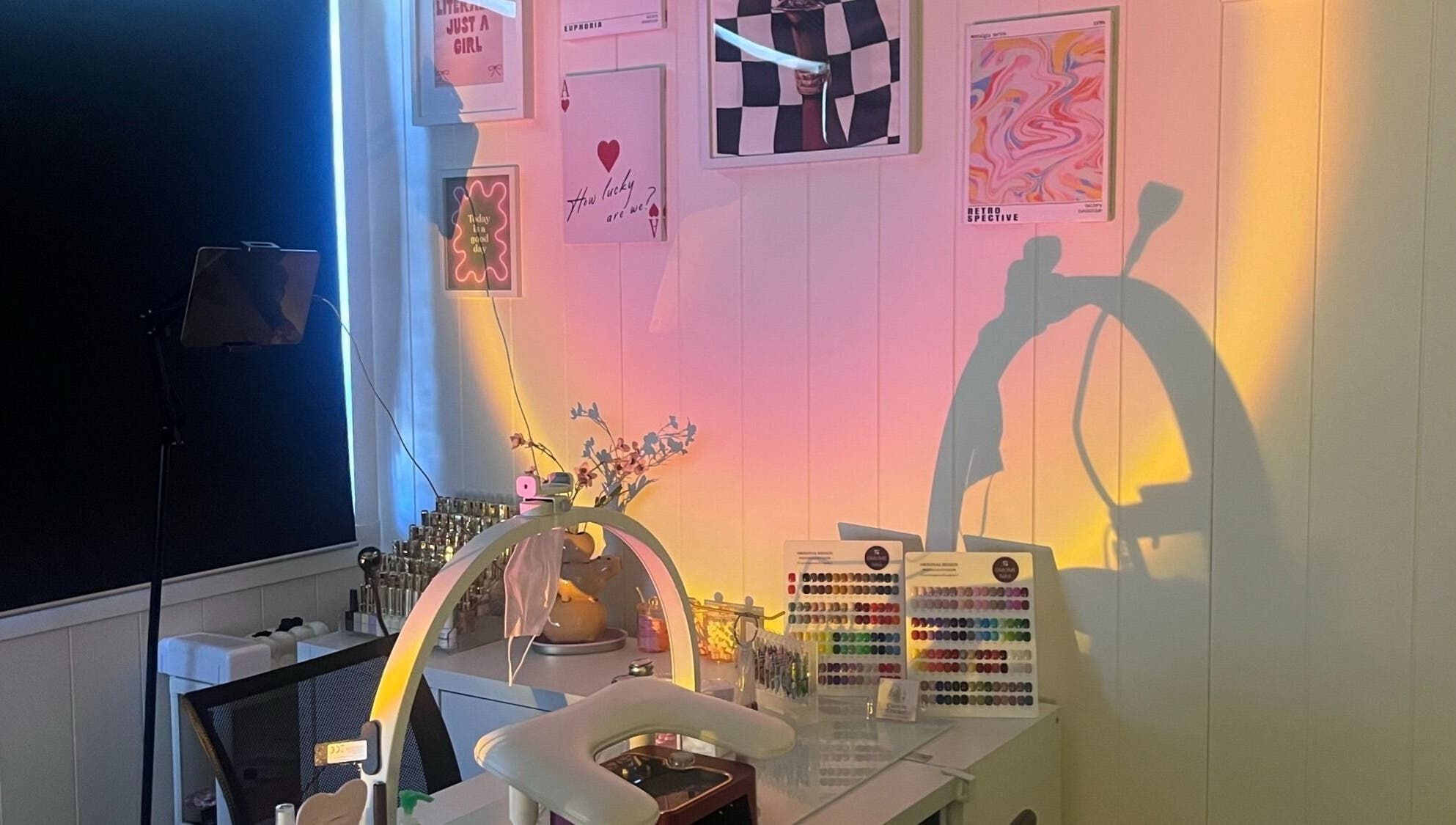 Nail art setup at Cuticle Cricket, Erskinville, New South Wales, AU, with colorful wall art and organized tools.