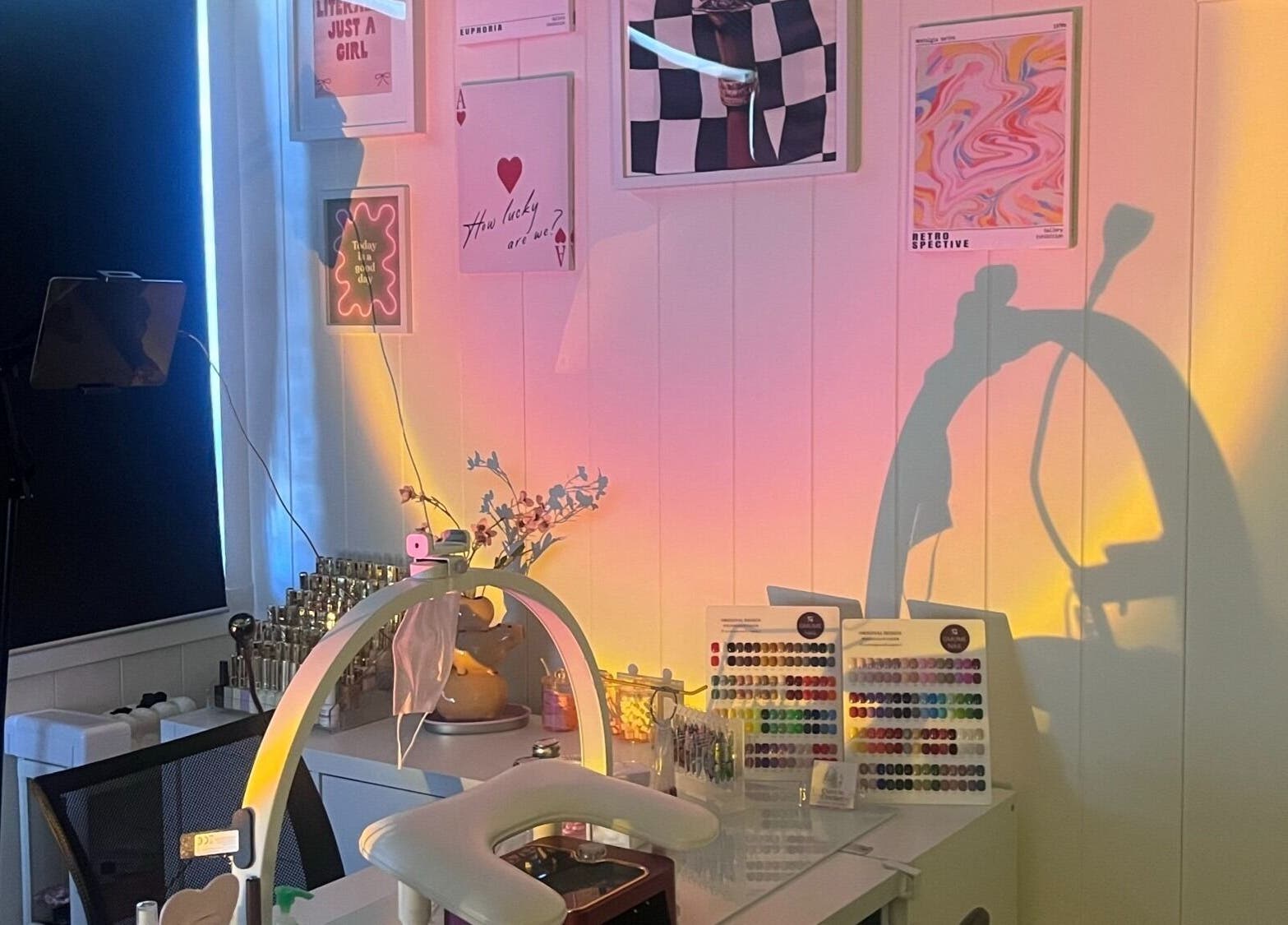 Nail art setup at Cuticle Cricket, Erskinville, New South Wales, AU, with colorful wall art and organized tools.