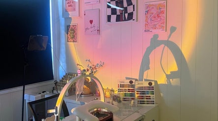 Nail art setup at Cuticle Cricket, Erskinville, New South Wales, AU, with colorful wall art and organized tools.