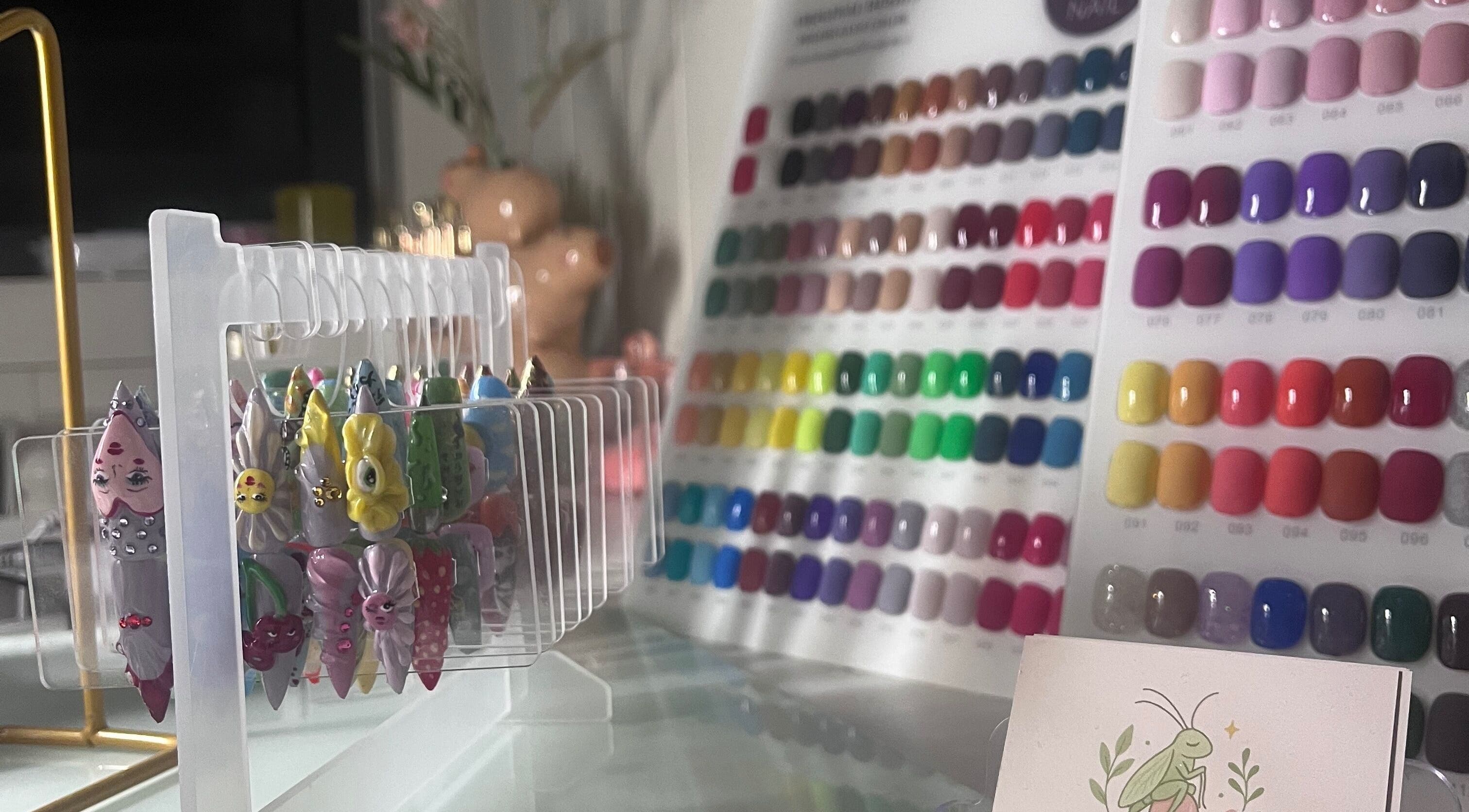 Diverse nail art collection at Cuticle Cricket in Erskinville, New South Wales, AU featuring colorful designs.
