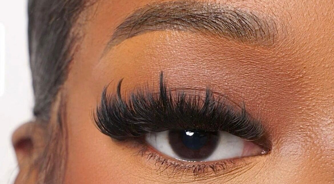 Close-up of elegant eyelash extensions at Lashedbyacc, Edmonton, Alberta, CA, showcasing refined beauty.