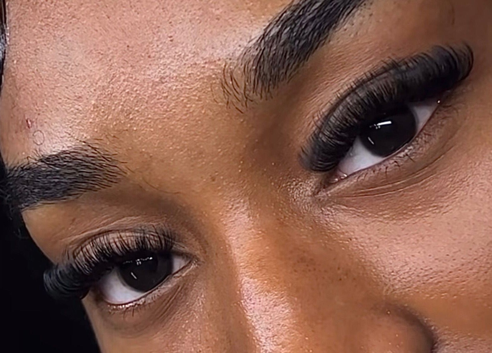 Close-up of eyelash extensions by Lashedbyacc in Edmonton, Alberta, CA.