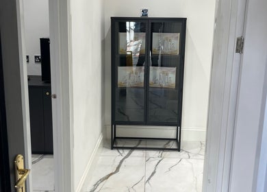 Sleek cabinet at SKIN GODS in Warrington, England, showcasing premium beauty products.