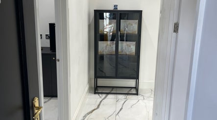 Sleek cabinet at SKIN GODS in Warrington, England, showcasing premium beauty products.