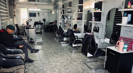 Spacious salon interior at FreshStyleBeautyHub in Thembisa, Gauteng, ZA, featuring modern styling stations.