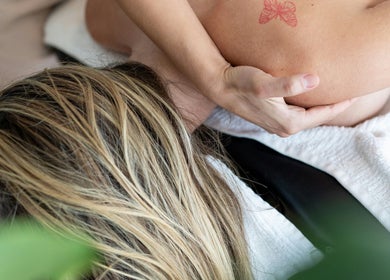 Relaxing massage at Revive Massage & Wellbeing in Stocksmoor, England, GB, showcasing serene therapy environment.