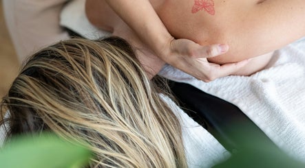Relaxing massage at Revive Massage & Wellbeing in Stocksmoor, England, GB, showcasing serene therapy environment.