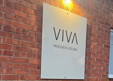 Viva Wellness Studio sign on brick wall, East Leake, England near HD Sports Injury Therapy.