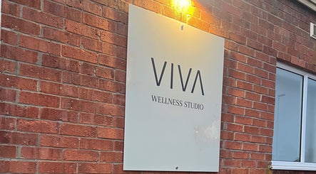 Viva Wellness Studio sign on brick wall, East Leake, England near HD Sports Injury Therapy.