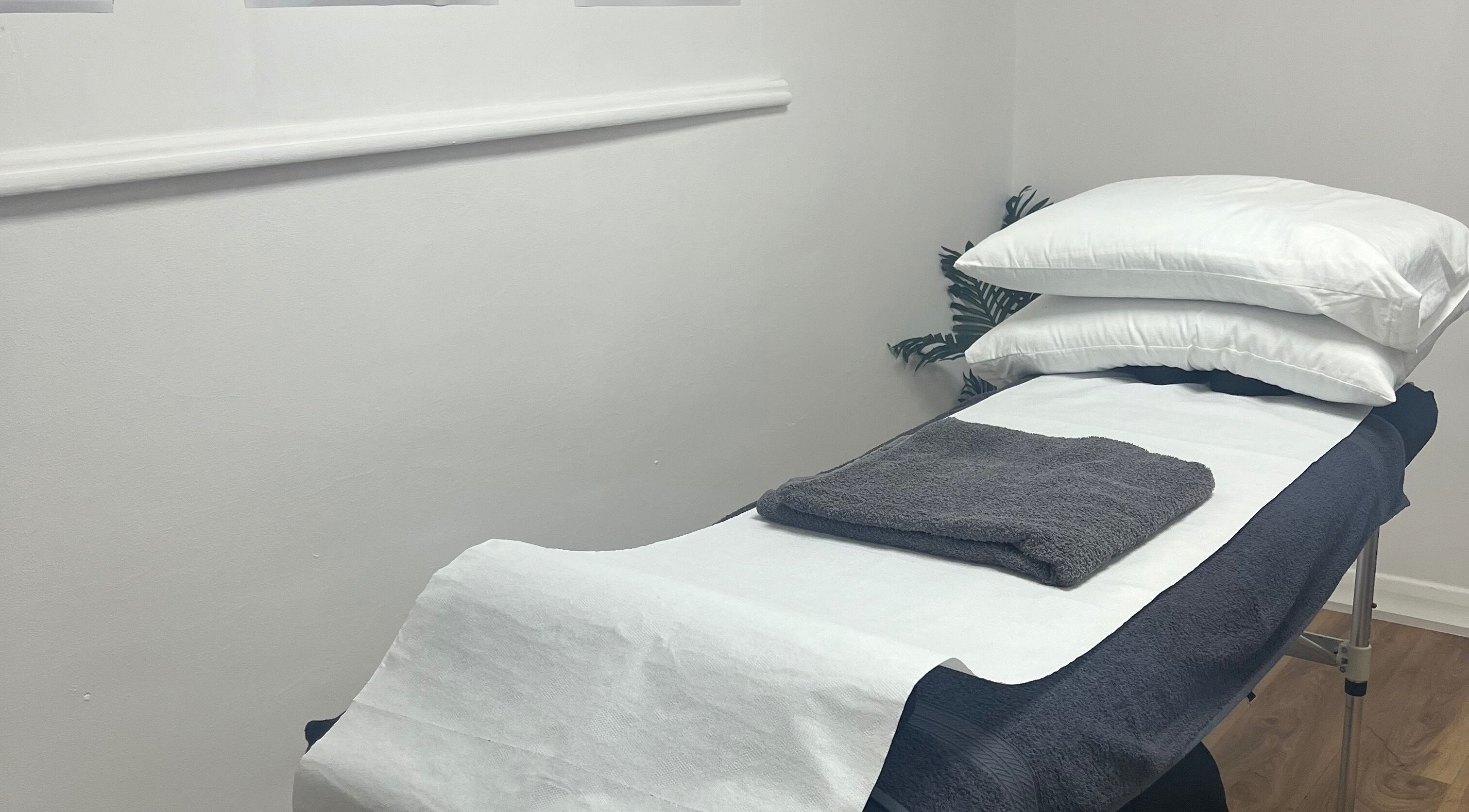 Cozy therapy bed at HD Sports Injury Therapy, East Leake, England, GB, ready for client comfort.