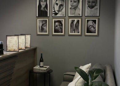 LuBelle Studio lounge with artistic portraits on walls, located in Randburg, Gauteng, ZA.