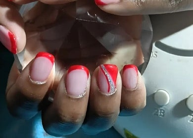 Stylish red nail art at P.l.P Beauty Studio in Randburg, Gauteng, ZA, showcasing creative designs.
