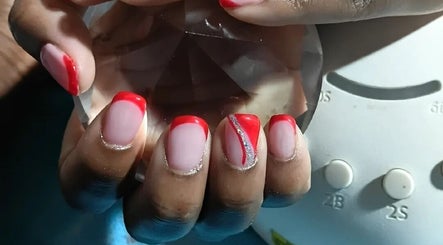 Stylish red nail art at P.l.P Beauty Studio in Randburg, Gauteng, ZA, showcasing creative designs.