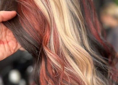 Close-up of vibrant multicolored hair styled at LMS HAIR, Welling, England, GB.
