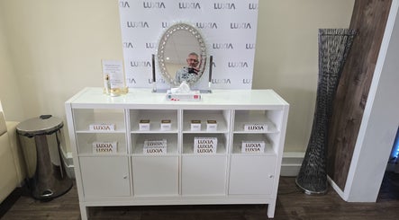 Luxia product display at Coolcontours, Windsor, England, GB featuring mirror and storage.