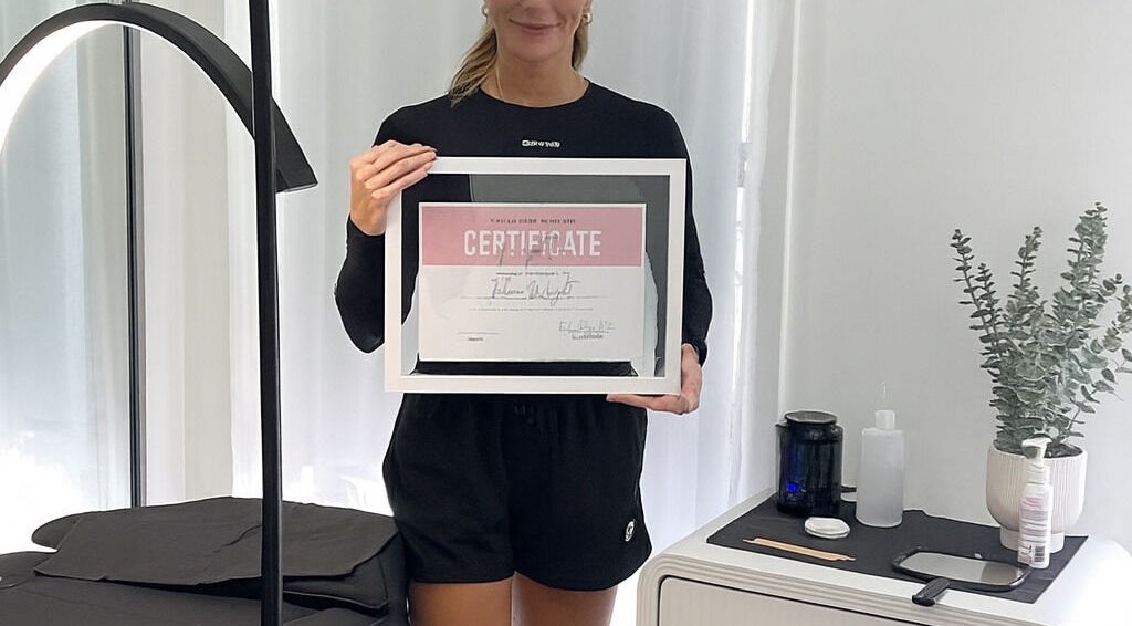 TW BROWS staff with certification in Claremont Meadows, New South Wales, AU beauty services room.