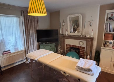 Cozy massage room at Mustr Massage, Nether Winchendon, England, GB with elegant decor and massage table.