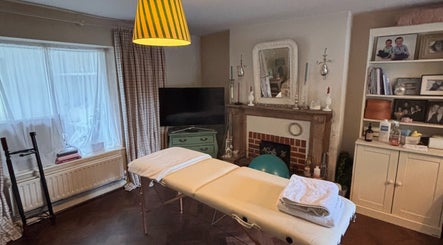 Cozy massage room at Mustr Massage, Nether Winchendon, England, GB with elegant decor and massage table.
