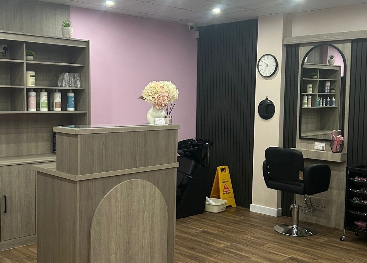 The Pink Edit salon interior showcasing sleek styling stations in Bournemouth, England, GB.