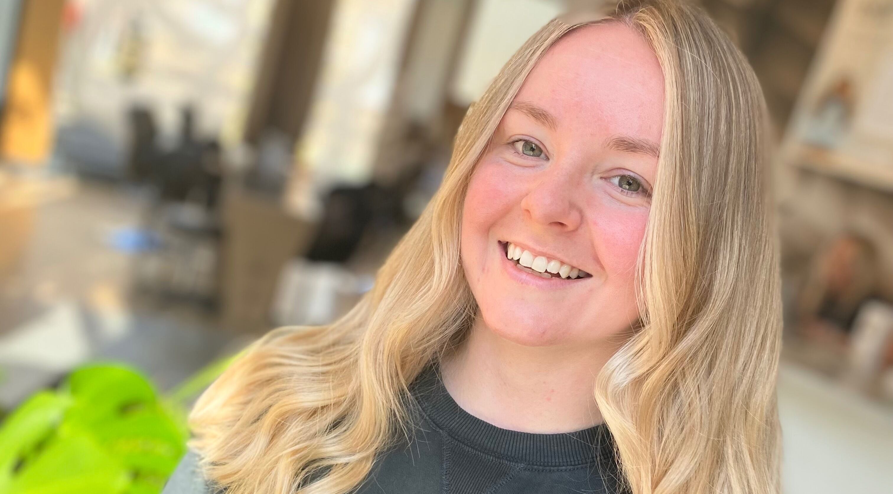 Smiling client with blonde hair at Blonde Bliss, Aberdeen, Scotland, GB.