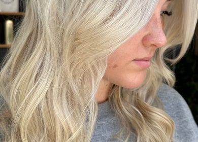 Close-up of blonde hair styled with soft waves at Blonde Bliss, Aberdeen, Scotland, GB.