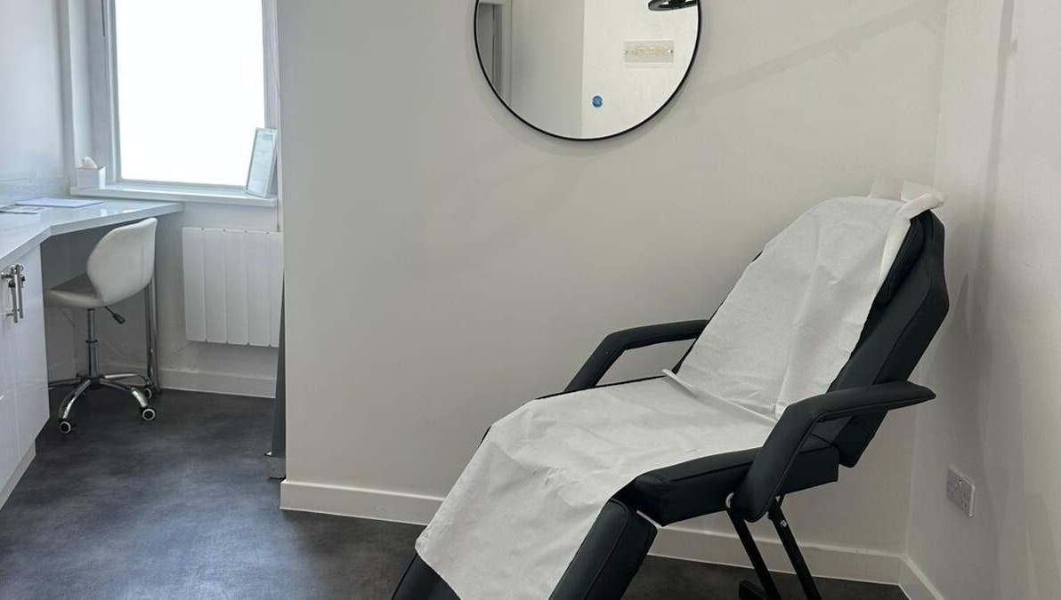Relaxing treatment room at Simply Glow Aesthetics in Bathgate, Scotland, GB, with a comfortable chair set up.