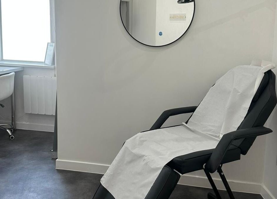 Relaxing treatment room at Simply Glow Aesthetics in Bathgate, Scotland, GB, with a comfortable chair set up.