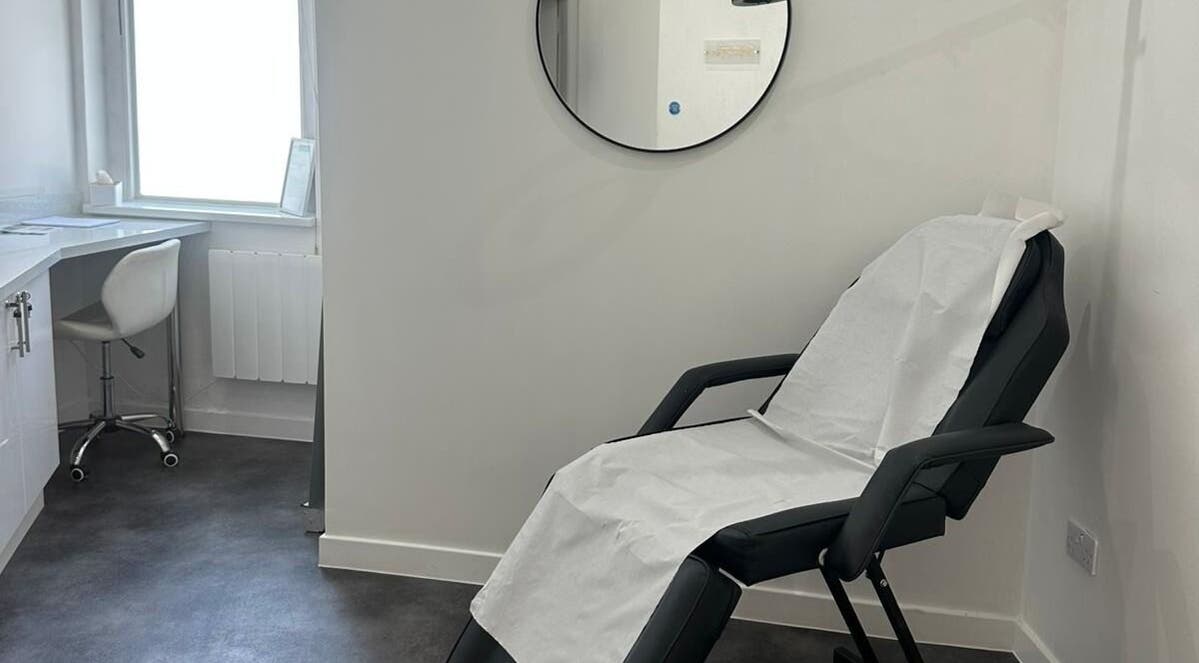 Relaxing treatment room at Simply Glow Aesthetics in Bathgate, Scotland, GB, with a comfortable chair set up.