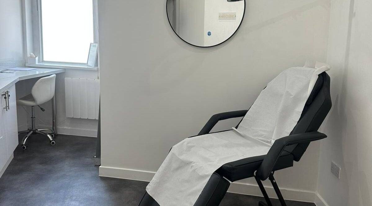 Relaxing treatment room at Simply Glow Aesthetics in Bathgate, Scotland, GB, with a comfortable chair set up.