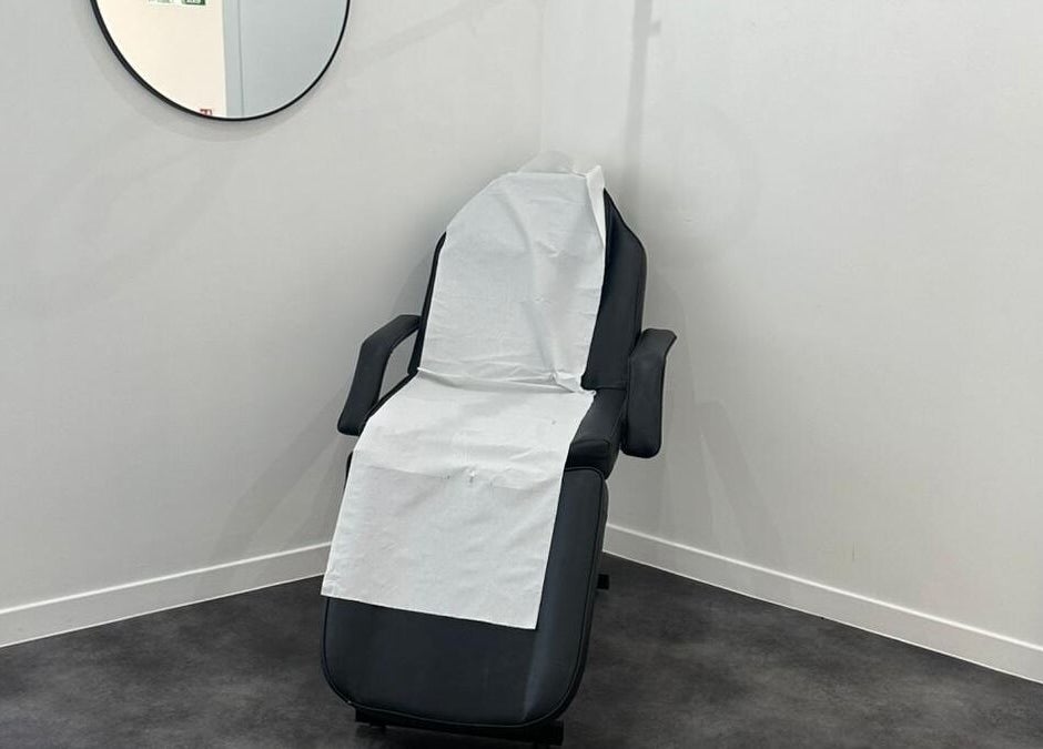 Treatment chair at Simply Glow Aesthetics, Bathgate, Scotland, GB, offering a serene environment for wellness.