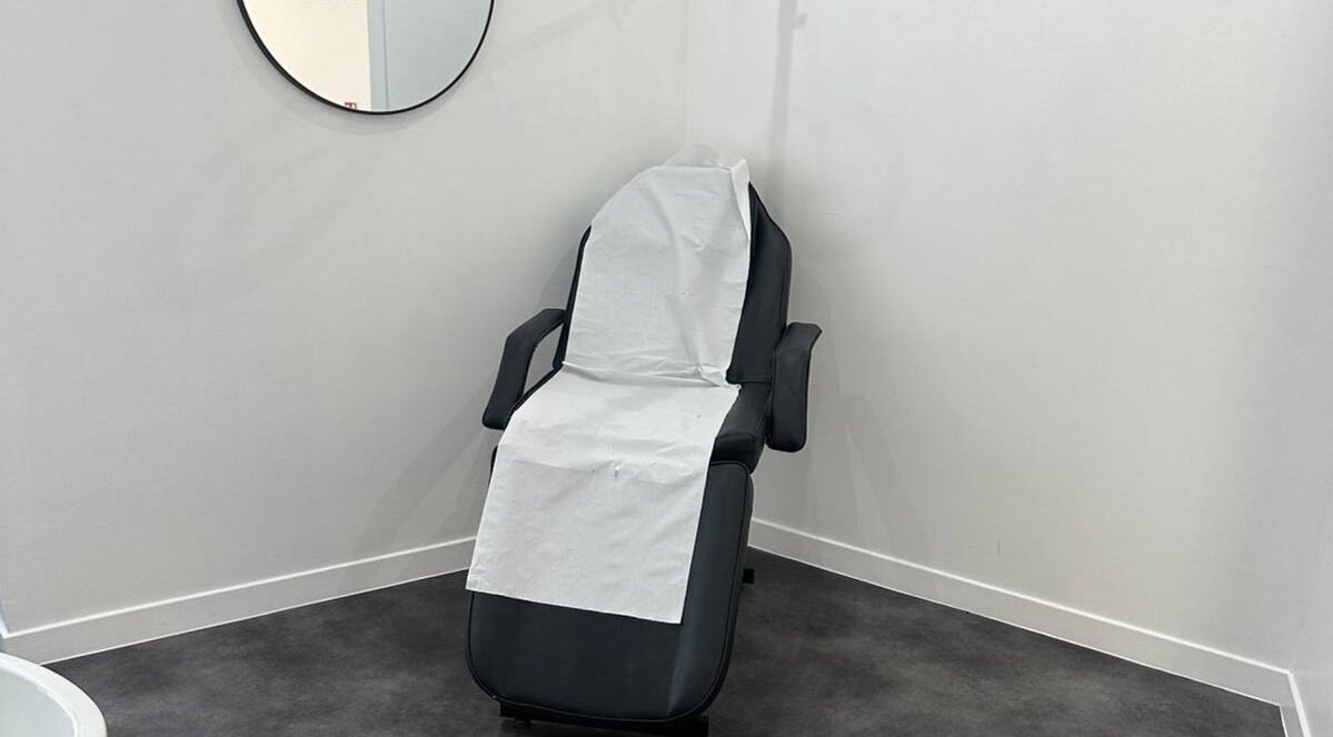 Treatment chair at Simply Glow Aesthetics, Bathgate, Scotland, GB, offering a serene environment for wellness.