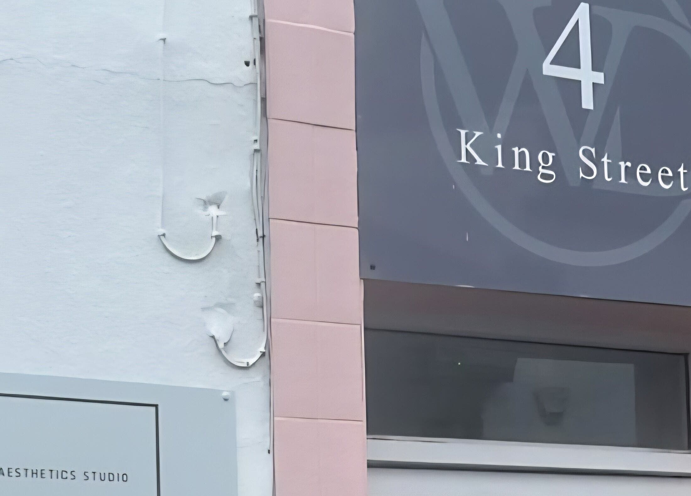 Front sign of Simply Glow Aesthetics at 4 King Street, Bathgate, Scotland, GB.